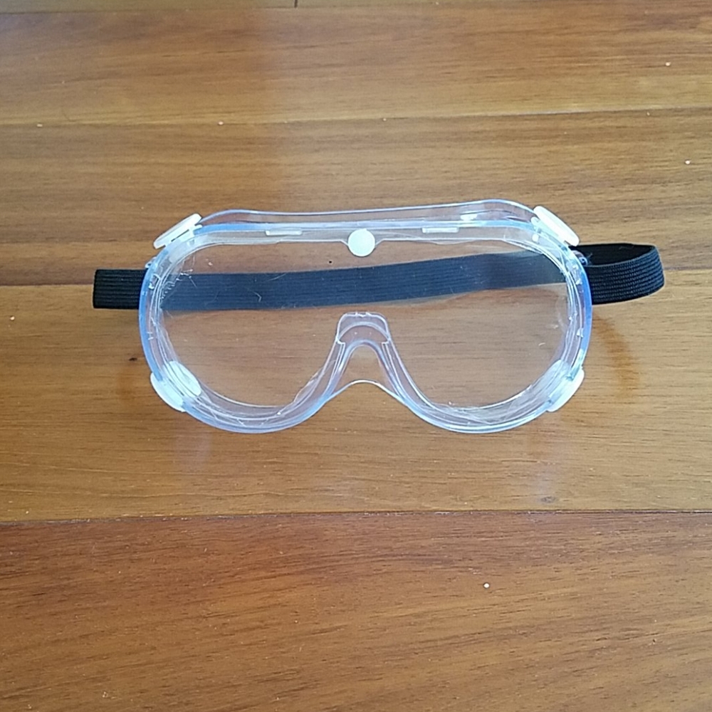 NWOT Clear safety goggles with black strap.